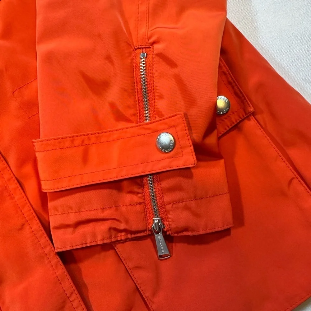 NWOT Michael Kor’s Women's Orange Hooded Rain Coat Jacket with silver details
